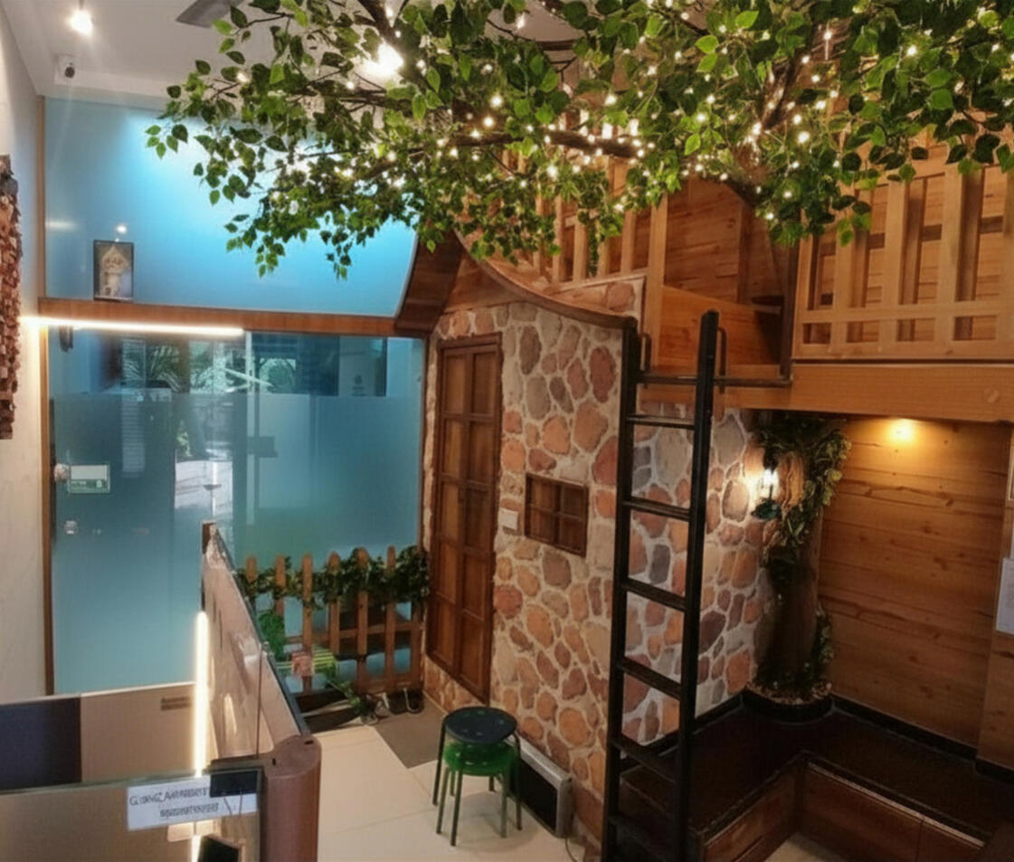 Child-friendly reception with treehouse at pediatric dental clinic in Nerul
